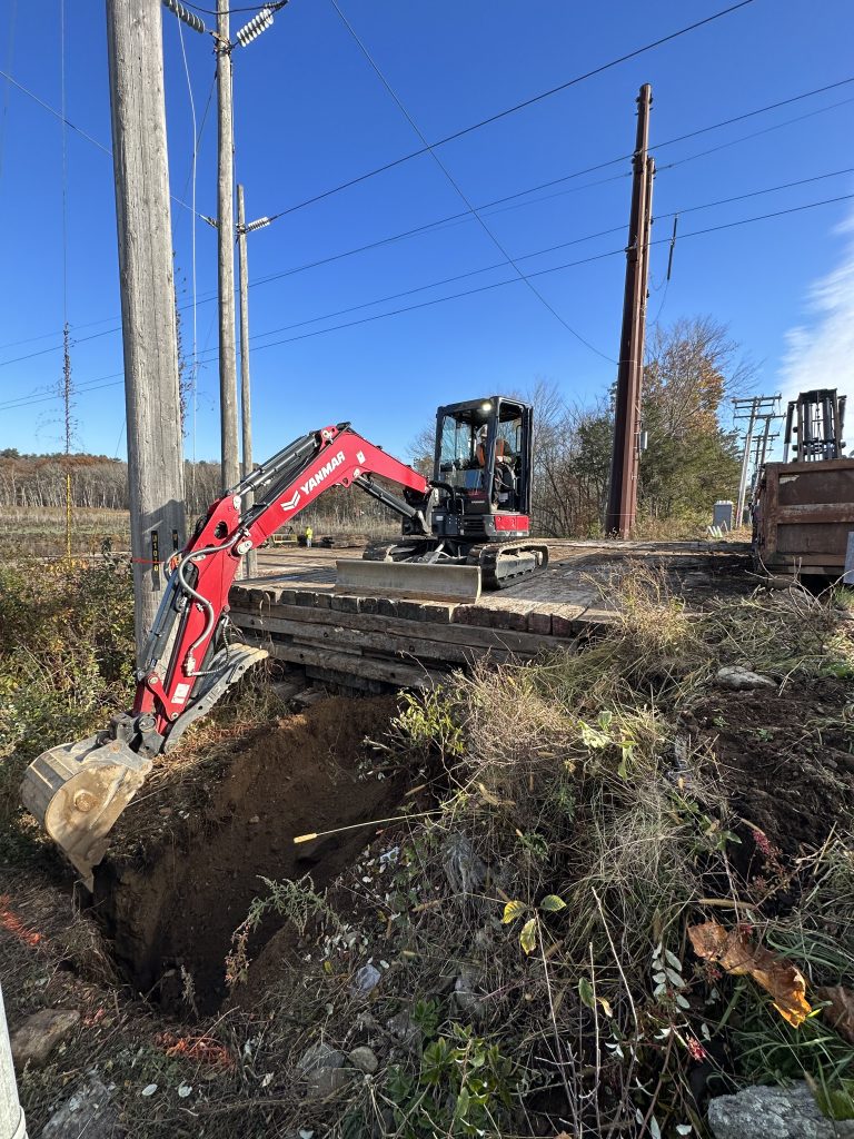 Excavation work performed by Tidy Services in Burlington, CT using an excavator
