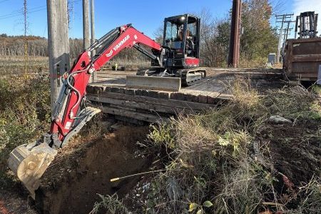 Excavation work performed by Tidy Services in Burlington, CT using an excavator